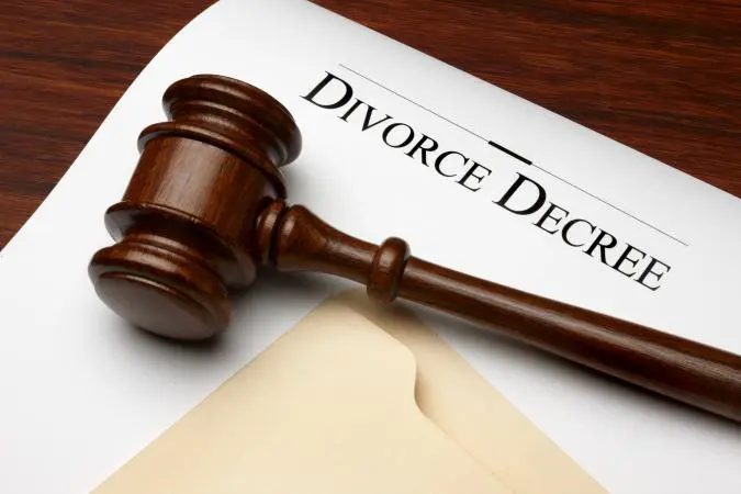 A gavel sitting on top of a divorce decree