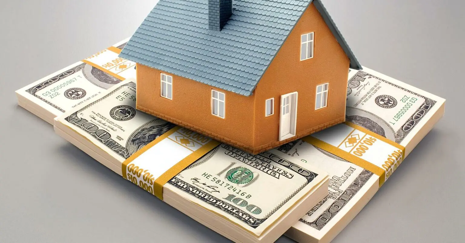 A house on top of stacks of money