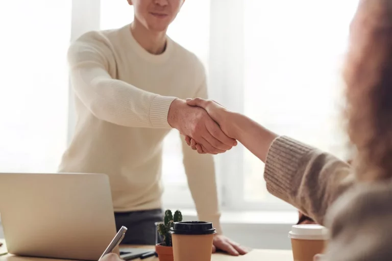 A Stambaugh tax prep expert shaking a client's hand