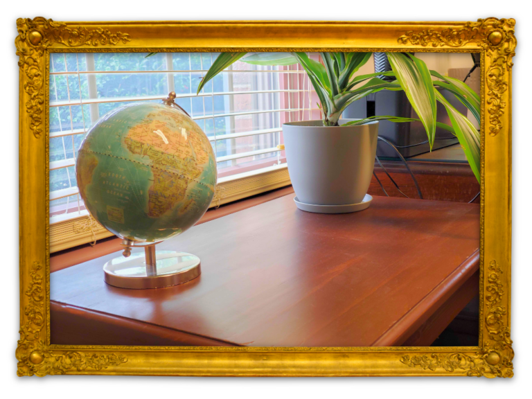 A globe and plant on a desk at Stambaugh Tax Law and Accounting, serving Lancaster, York, & Harrisburg, PA